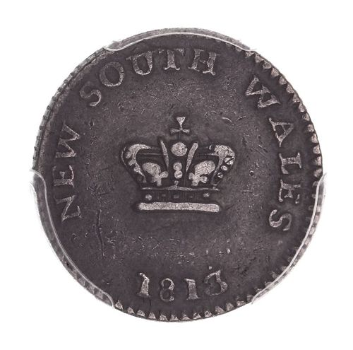 New South Wales, fifteen pence or dump, 1813 (Mira dies A/1). Trace of centre of the reverse of host coin on the reverse, old tool marks on the reverse, well struck with attractive gunmetal grey tone, good very fine.