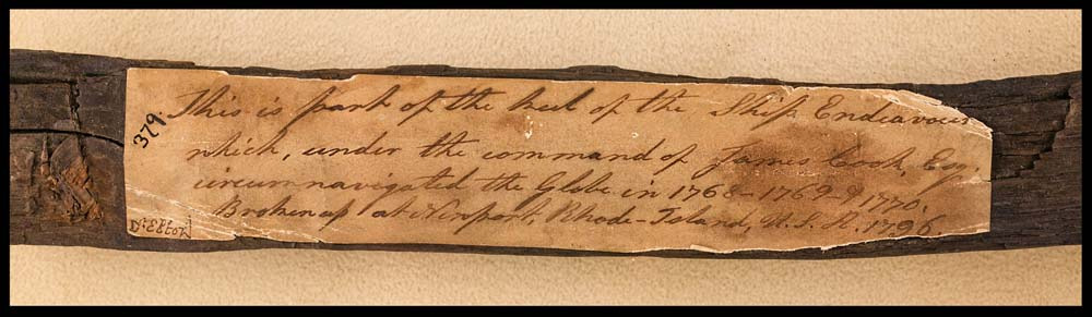 Captain James Cook's H.M. Bark Endeavour, a piece of timber (22cm long x 2cm wide) being part of the keel retrieved from the wreck of the ship at Newport, Rhode Island, USA., in a gilt timber framed display case with label attached, written in 18th century hand (probably that of Sir Joseph Bank's sister, Sarah) that reads, 'This is part of the keel of the Ship Endeavour which, under the command of James Cook, Esq, circumnavigated the Globe in 1768-1770, Broken up at Newport, Rhode-Island, U.S.A. 1796.' There are only two pieces of this historic ship in private hands, this one and the other is in a Sydney Collection, excessively rare and of the highest importance to Australian history.