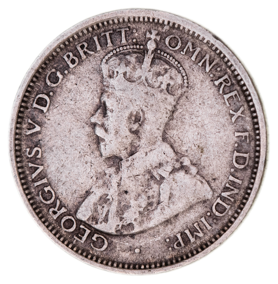 36 · MIS-STRIKES: George V, sixpence with die flaw resulting in a raised line running from the scroll and between numbers of the date.
