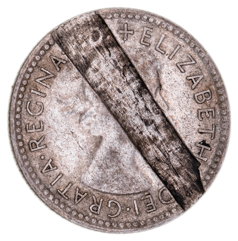 45 · MIS-STRIKES: Elizabeth II, sixpence, 1956, with major planchet flaw on obverse.